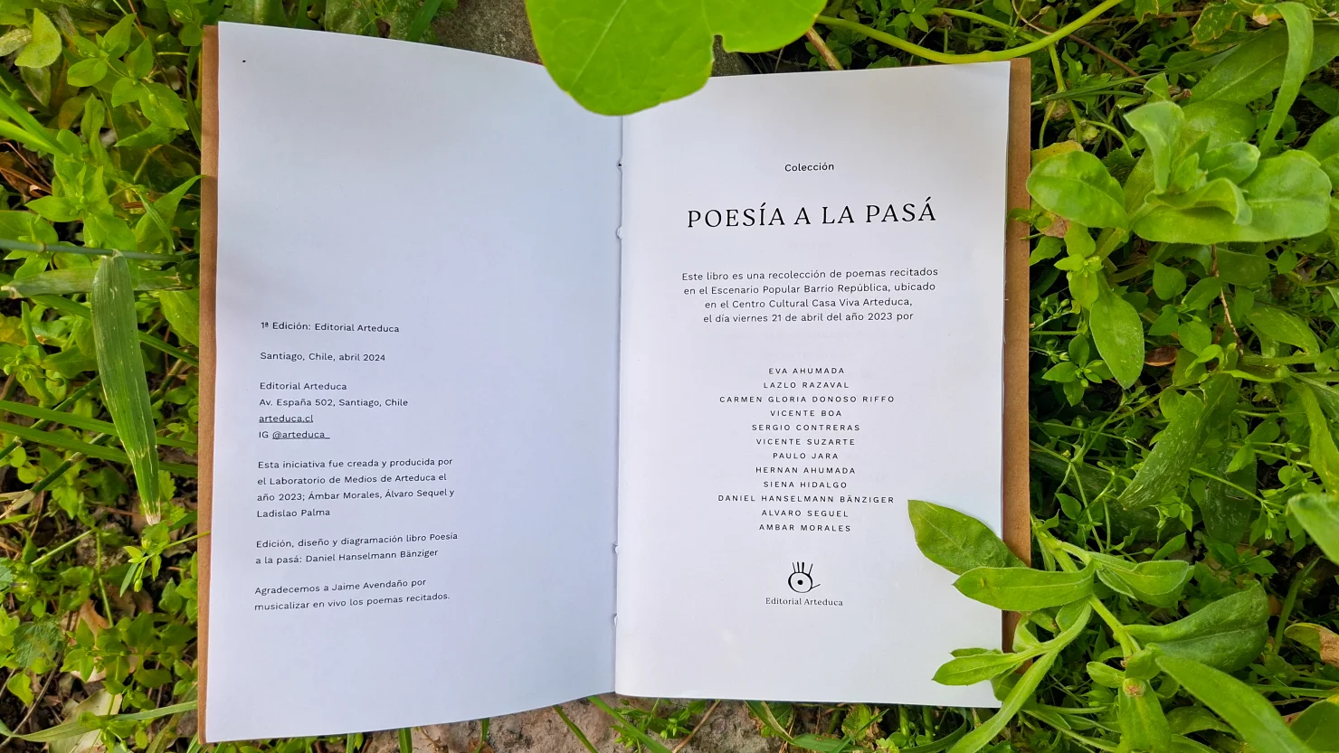 Open book at the title page and credits, on grass